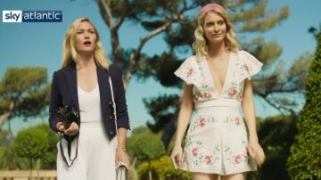 Navy blue double-breasted cropped jacket worn by Julia Stiles in Riviera Season Two Coming May 23