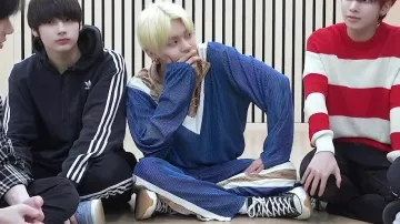 The pair of Converse x JW Anderson high tops black and white Yeonjun in the video [T:TIME] '세계가 불타버린 밤, 우린... (Can't You See Me?)’ MV reaction - TXT (투모로우바이투게더)