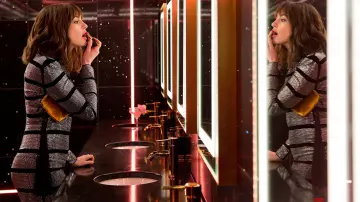 The Row tassel velvet pouch gold worn by Josephine Chesterfield (Anne Hathaway) in The Hustle