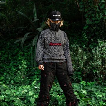 The sweater with a high collar Man ' Balenciaga worn by Trippie Redd on his account Instagram @trippieredd