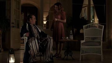 White and black striped silk pajamas worn by Fonse (Tom Hardy) as seen in Capone