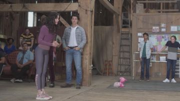 Purple top worn by April Dibrina (Sofia Carson) as seen in Feel the Beat
