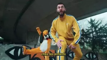 The Nike tracksuit yellow worn by Cyprian in the YouTube video THE COURT OF the GREAT (clash Squeezie)