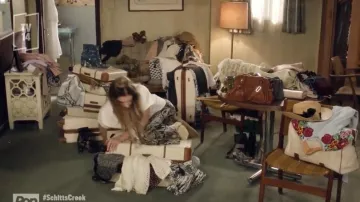 Blue dress with flowers of Alexis Rose (Annie Murphy) in Schitt's Creek (S06E01)