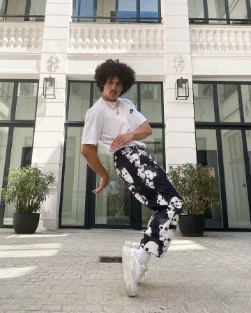 The black pants with printed white faces worn by Rilès on his account Instagram @0riles