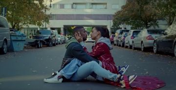 White and Blue Yellow Nike Jordan Sneakers worn by Michael B. Jordan in Whoa music video by Snoh Aalegra