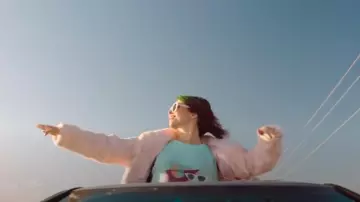 Pink Faux Fur Coat worn by Sarah (Cristin Milioti) in Palm Springs