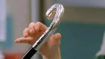 The cane-head money of Dr. Gregory House (Hugh Laurie) in House md