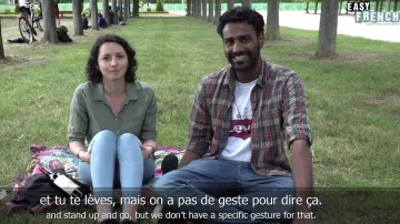 The t-shirt white Levi's with the Peanuts Gang in the YouTube video Gesture Challenge: France vs. India | Easy English 108