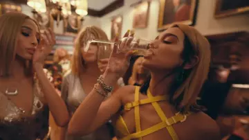 Green earrings worn by Dua Lipa in the YouTube video Dua Lipa - Don't Start Now (Official Music Video)