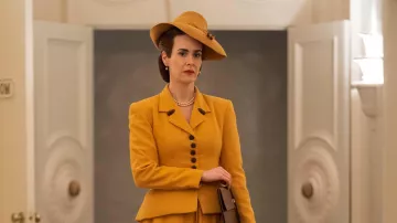 Orange Yellow Button Blazer Jacket and Skirt ensemble worn by Nurse Mildred Ratched (Sarah Paulson) in Ratched TV series outfits (Season 1 Episode 1)