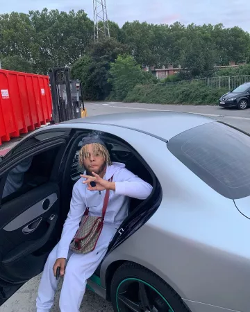 The white Ralph Lauren hooded vest worn by Zola on his Instagram account @binkszola