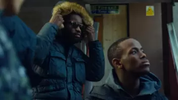 The Stone Island parka worn by Morris "Modie" Gregory (David Omoregie) in the series Top Boy (Season 3 Episode 9)
