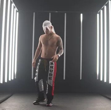 Rhude Rhacing Logo Pants worn by Kevvo on his Instagram account @kevvoofficial