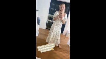 Dakota Fanning wears a white summer dress printed in a video on Instagram on July 17, 2020