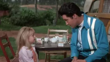 Outfits of Speedway Movie: Elvis Presley wears Blue Jacket with white bands to portray Steve Grayson