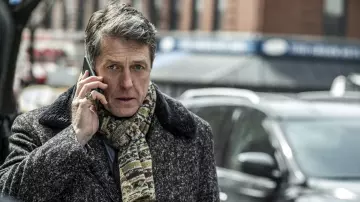 Outftits of The Undoing: Jonathan Fraser (Hugh Grant) wears wool coat with fur collar in season 1, episode 7