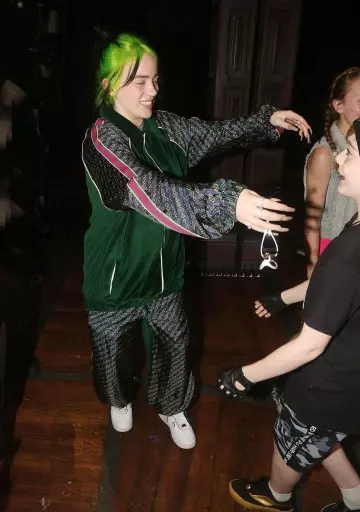 Gucci track pants worn by Billie Eilish backstage at "Harry Potter and The Cursed Child, Parts 1 & 2" on Broadway at The Lyric Theatre on September 29, 2019