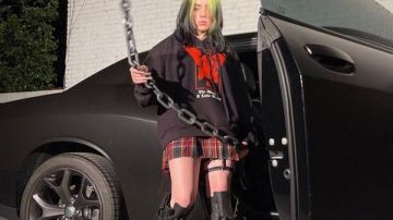 Dolls Kill Ob­sid­i­an Pock­et Com­bat Boots worn by Billie Eilish on the Instagram account of @Blohsh