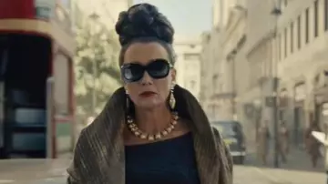 Golden coat worn by Baroness (Emma Thompson) as seen in Cruella movie