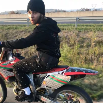 The black Ralph Lauren printed pants worn by Zola on his Instagram account@binkszola