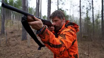 Orange camo parka jacket worn by Rayburn (Nikolaj Coster-Waldau) as seen in The Silencing movie