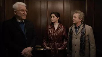 Asos vinyl trench coat with contrast stitching in oxblood worn by Mabel Mora (Selena Gomez) as seen in Only Murders in the Building wardrobe (S01E04)