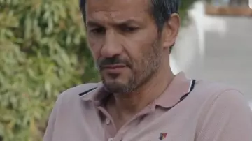The pink polo shirt worn by Dr. William Daunier (Kamel Belghazi) in the series Tomorrow belongs to us