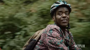 The printed jacket Obey worn by Eric Effiong (Ncuti Gatwa) in the series Sex Education (Season 3 Episode 1)