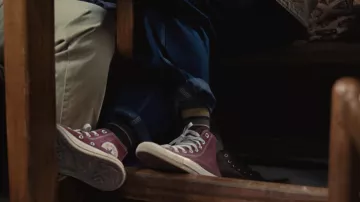 Converse All Star Hi Top sneakers in burgundy worn by April (Alicia Vikander) as seen in Beckett movie