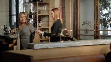 Salvatore Ferragamo scarf-panel asymetric blazer worn by Alex Levy (Jennifer Aniston) as seen in The Morning Show TV series wardrobe (S02E03)