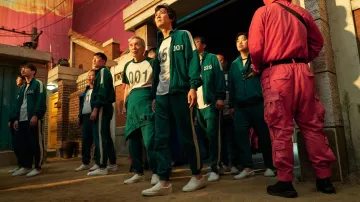 Vans white Slip-on sneakers worn by Seong Gi-hun (Lee Jung-jae) as seen in Squid Game Tv series outfits (Season 1 Episode 6)