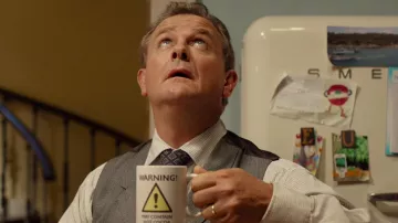 Advertencia puede contener taza de cacao caliente de Henry Brown (Hugh Bonneville) como se ve en la película de Paddington
