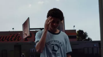 Dutcher MS PHYS ED Ringer T-Shirt worn by Young Colin Kaepernick (Jaden Michael) as seen in Colin in Black & White wardrobe (Season 1 Episode 2)