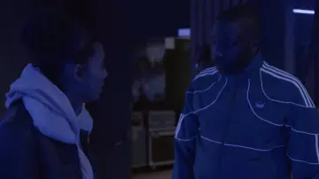 The tracksuit jacket Adidas green worn by William (Saïdou Camara) in the series Validated (Season 2 Episode 3)