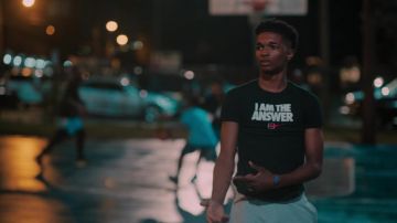 Nike 'I AM THE ANSWER' black t-shirt worn by Jace (Isaiah R. Hill) as seen in Swagger Tv series outfits (Season 1 Episode 2)