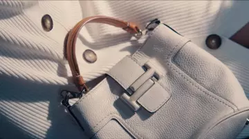 Tod's Double T bucket bag in white worn by Madeleine (Léa Seydoux) as seen in No Time to Die movie wardrobe