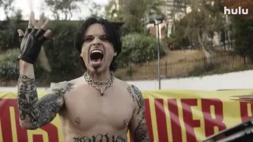 Padlock necklace worn by Tommy Lee (Sebastian Stan) as seen in Pam & Tommy TV series wardrobe (Season 1)