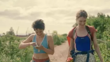 Reebok blue tank top worn by Kirsten (Mackenzie Davis) as seen in Station Eleven Tv series outfits (Season 1 Episode 1)