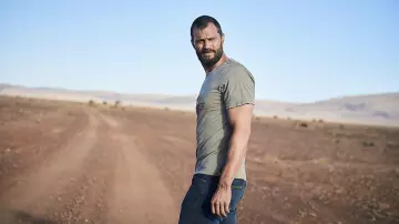 Grey Tee worn by The Man (Jamie Dornan) as seen in The Tourist (Season 1) TV series