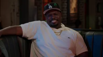 Lacoste White Polo Shirt worn by Sherm Jones (Carl Tart) as seen in Grand Crew TV series outfits (S01E05)