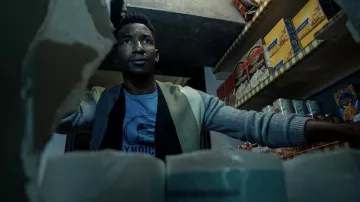 Cardigan worn by Dan Turner (Mamoudou Athie) as seen in Archive 81 TV series outfits (Season 1)