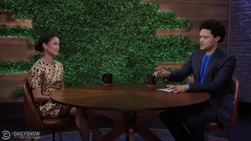 The Vampire's Wife Gold printed dress worn by Gugu Mbatha-Raw as seen in The Daily Show with Trevor Noah on February 3rd, 2022