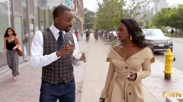 A.W.A.K.E. Mode off-the-shoulder trench coat worn by August King (Ebonee Noel) as seen in The Kings of Napa TV series outfits (Season 1 Episode 5)