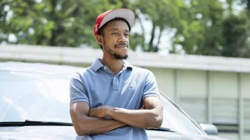 Tommy Hilfiger Grey Polo Shirt worn by Jemell Rayam (Darrell Britt-Gibson) as seen in We Own This City Outfits (Season 1)