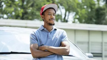 Tommy Hilfiger Grey Polo Shirt worn by Jemell Rayam (Darrell Britt-Gibson) as seen in We Own This City Outfits (Season 1)