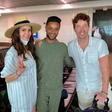 The striped hat, shirt and shorts worn by Nina Dobrev on @dancebysanch's Instagram account