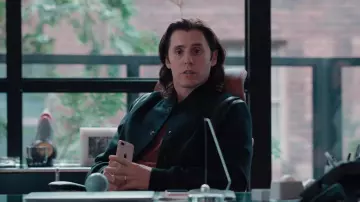 Saint Laurent Varsity wool jacket in black worn by Adam Neumann (Jared Leto) as seen in WeCrashed (S01E05)