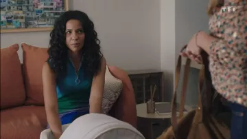 The blue, green and purple dress sparkling Maje worn by Marta Guéraud (Sarah Fitri) in the series Here it all begins