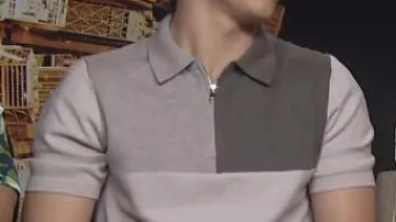 The gray reiss wool polo shirt worn by Tom Holland during an interview for the promotion of the movie Spider-Man: No Way Home